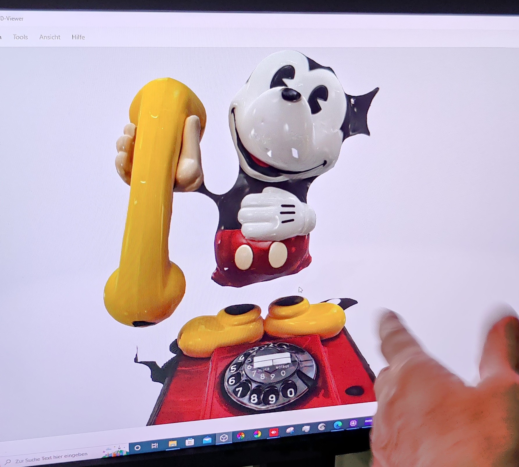 Mickey Mouse phone 3D model that shows lack of reproduction of shiny black parts so Mickey Mouse is missing arms and legs. 