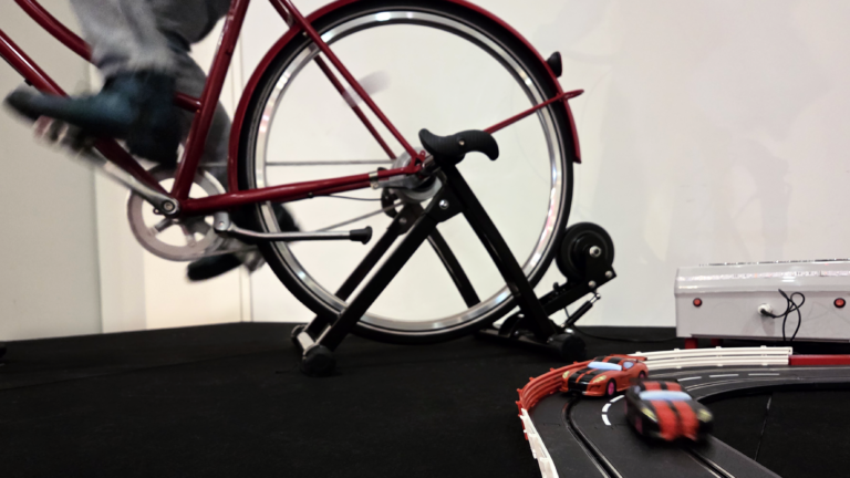 Pedal-powered racetrack, electricity is generated by pedaling the bicycle.